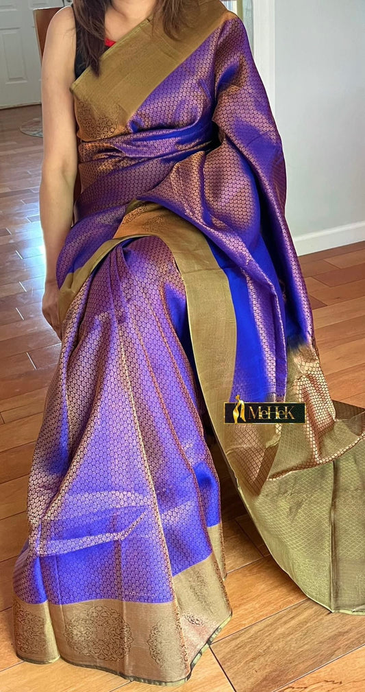 Soft Silk Kanjivaram In Two tone Purple and Golden color  with all over woven Zari